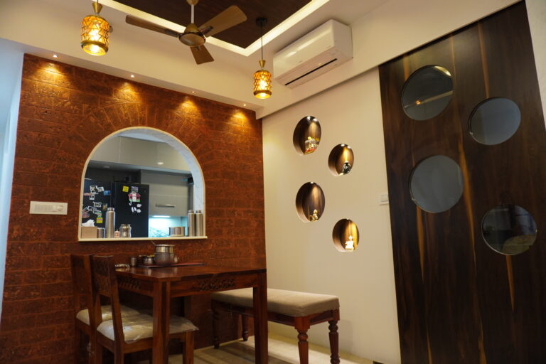 Laterite stone wall with an arched mirror in a completed home